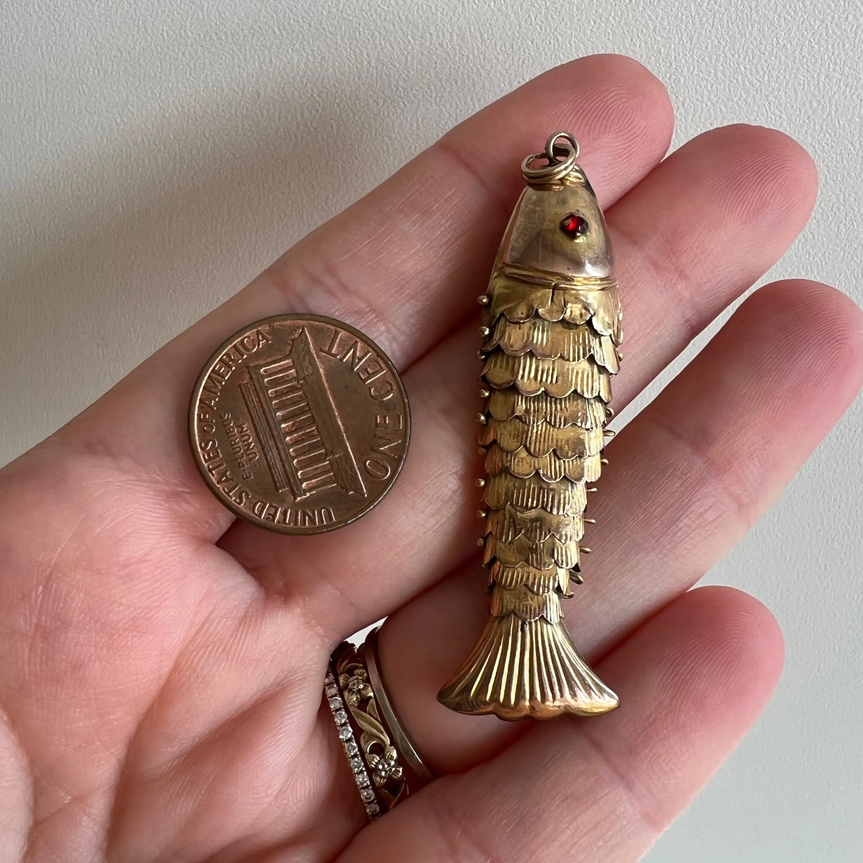 A N T I Q U E // resilient articulation / 14k rosy yellow gold and red glass articulated wiggle fish / a pendant