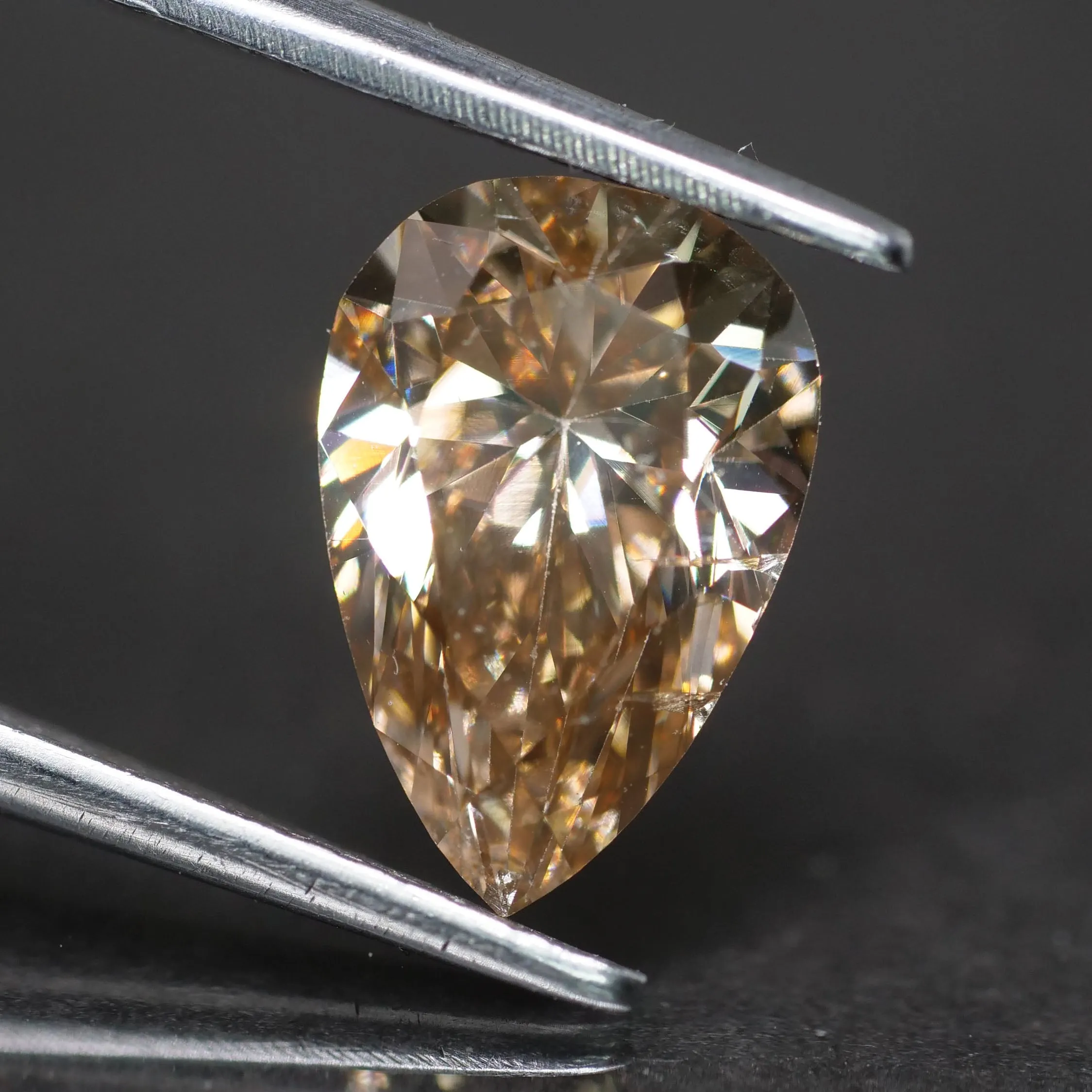 Natural diamond | Certified | fancy champagne, pear cut 10x7mm*, light brown color, SI1, 1.78 ct